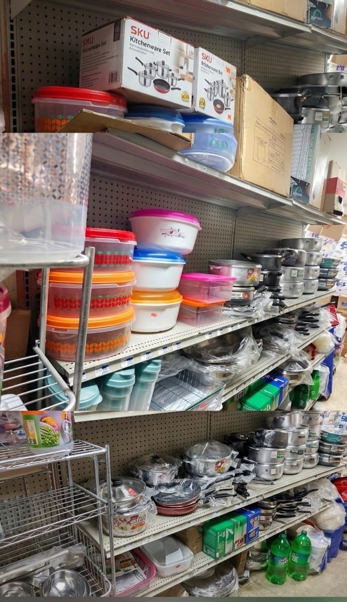 Shelves of food containers, pots, pans and kitchenware sets